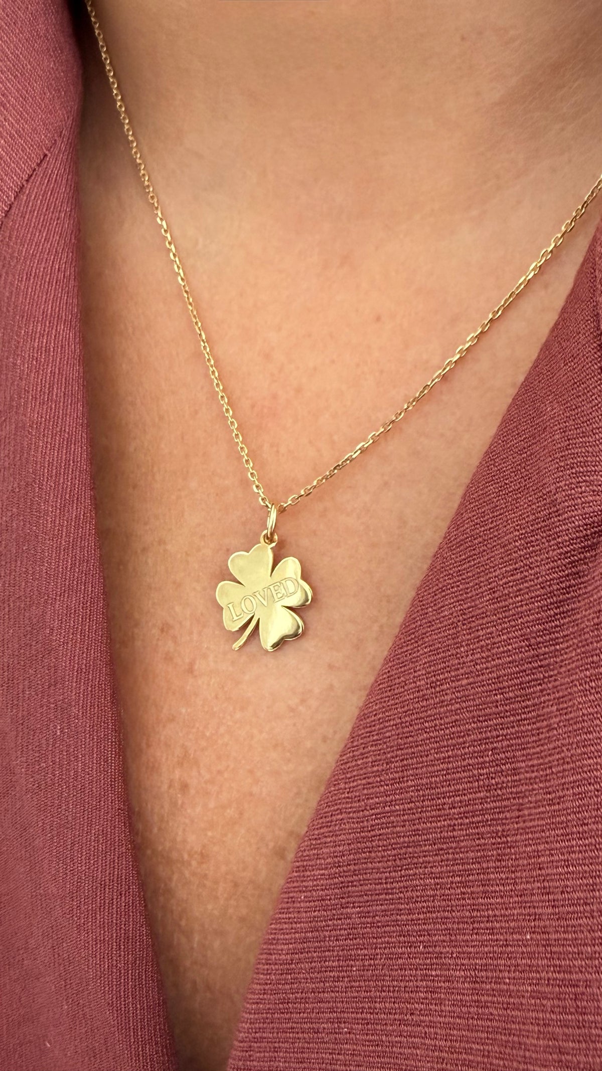 Loved Clover Necklace, LOVED, yellow gold tone, lifestyle view