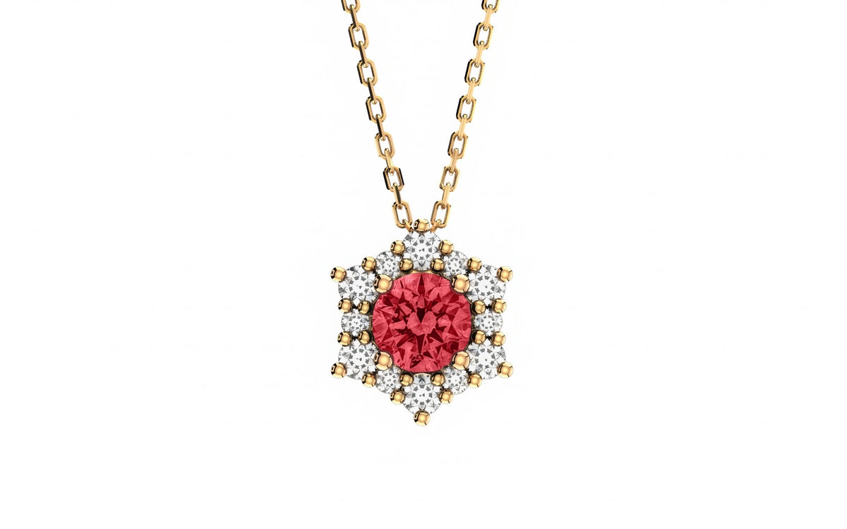 Gold necklace with a red gemstone pendant on a white background