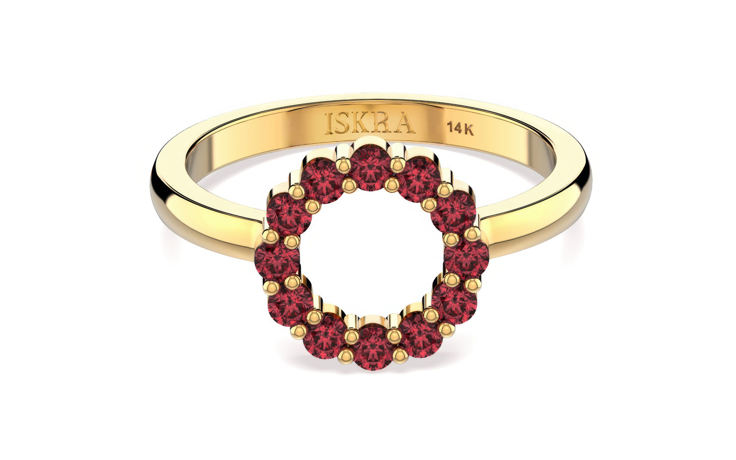 Gold ring with red gemstones on a white background