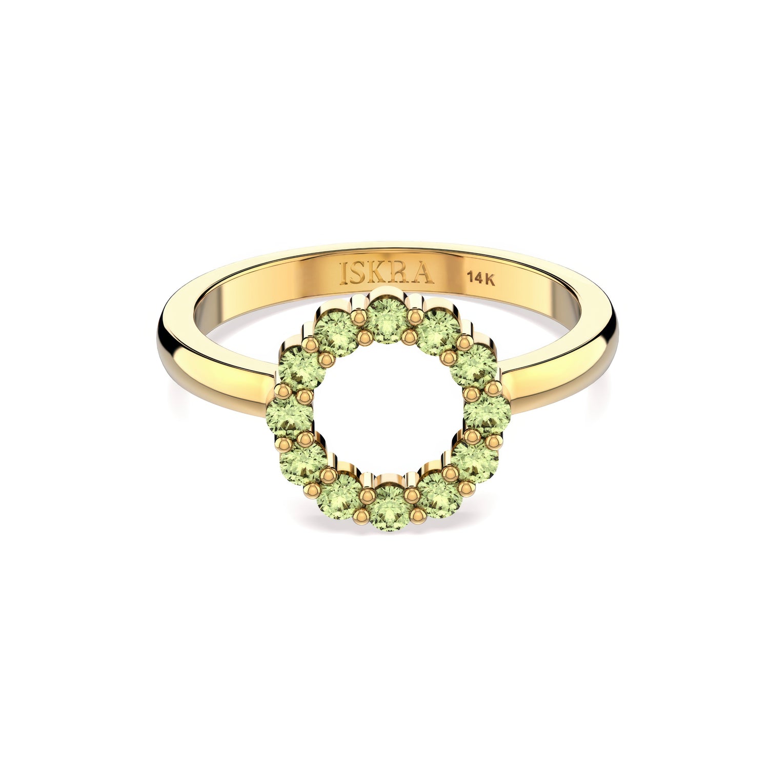 Gold ring with green gemstones on a white background