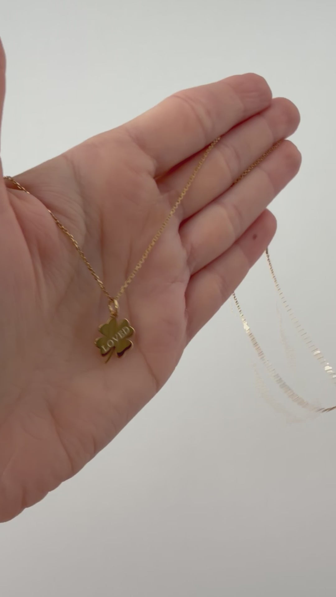 Loved Clover Necklace, LOVED, yellow gold tone, lifestyle video